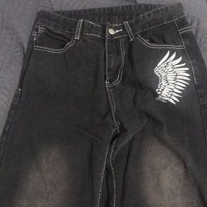 Light washed black jeans with wing design